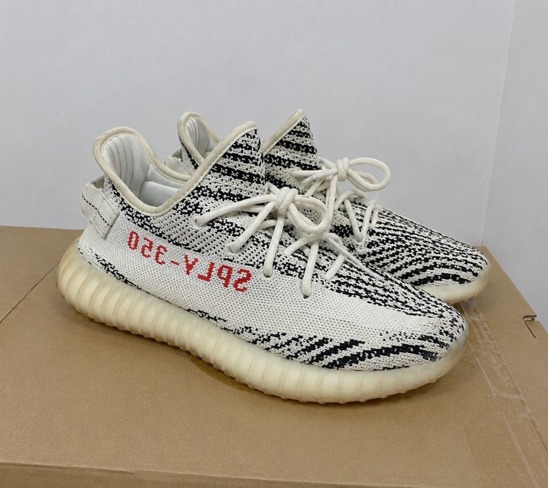 Adidas Yeezy Boost 350 V2 Zebra (Category: Sneakers) located in Batangas. Submitted by curatedluxxe88 (Listing ID 1452099084, Image 1). Description: - Iconic Adidas Yeezy Boost 350 V2 Zebra design - Classic black and white zebra stripe pattern - Bold red 'SPLY-350' text on the side - Comfortable knit upper for a snug fit - Responsive Boost sole for all-day comfort - Ideal for everyday wear and streetwear style.