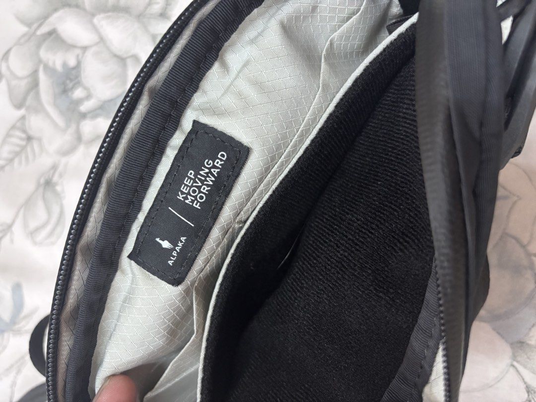 Alpaka Flight Sling 1L - Black (Category: Sling Bags) located in Manila. Submitted by reyuben (Listing ID 1451942790, Image 2). Description: Packable and lightweight • Main zipper compartment • Soft-lined phone sleeve • Discreet rear slip pocket • Detachable shoulder strap • YKK AquaGuard zippers EXTERIOR • Axoflux 210D ripstop nylon in Black or Green INTERIOR • Axoflux X-Grid 150D ripstop polyester in Gray Note: I removed the Mod Key Tether in t