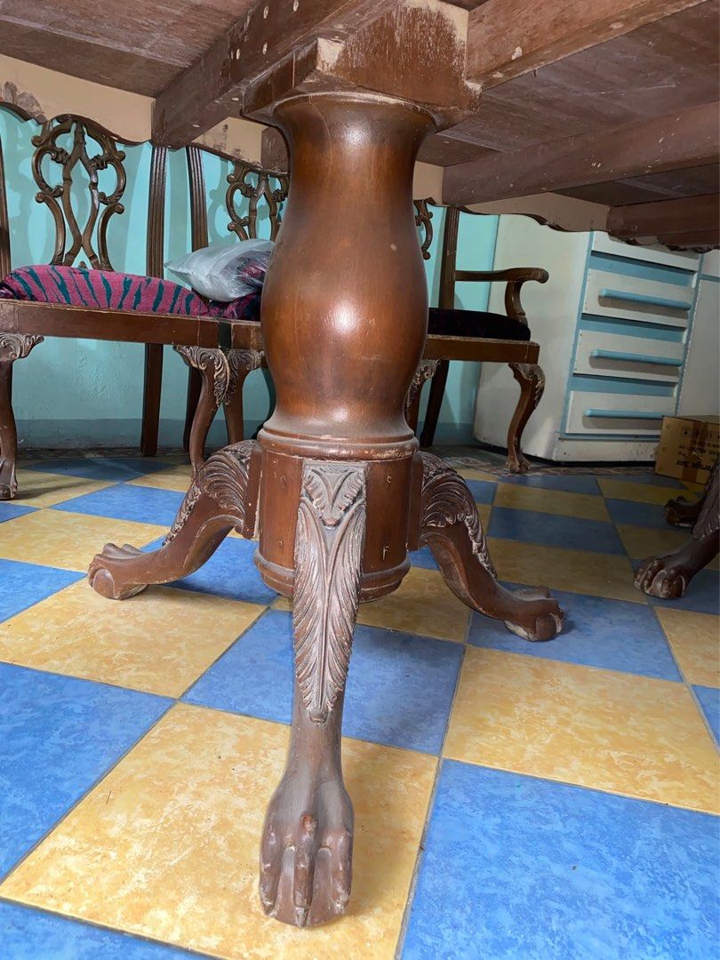 Antique Wooden Dining Table with Claw Feet (Category: Tables & Sets) located in Marikina City. Submitted by scarlet6789 (Listing ID 1452099123, Image 2). Description: - Large antique wooden dining table - Beautiful carved claw feet design - Dimensions: 2.2m (length) x 1.7m (width) x 75cm (height) - Ideal for hosting family gatherings and large meals.