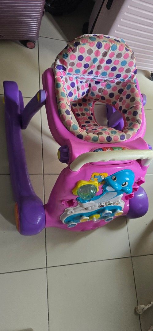 Apruva Pink Dolphin Baby Walker PHP300 only (used) (Category: Infant Playtime) located in Quezon City. Submitted by FredAver (Listing ID 1451959307, Image 2). Description: - Fun dolphin-themed baby walker - Lights up and plays music - Adjustable seat for comfort - Folds easily for convenient storage - Helps little ones learn to walk - Minor scuffs from normal use - PHP300 only (Used).