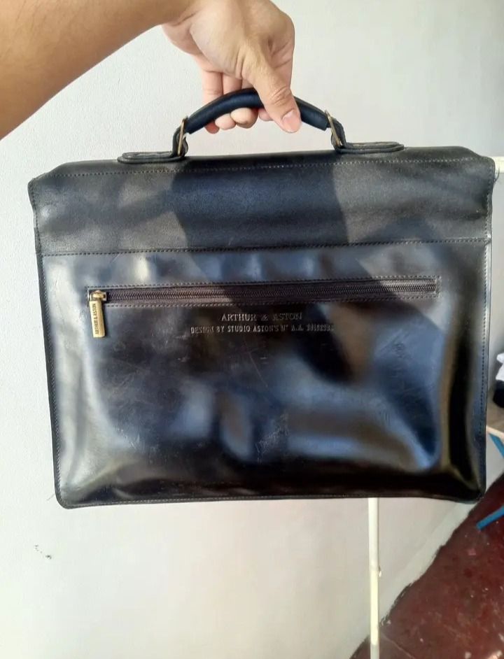 Arthur & Aston Black Leather Briefcase (Category: Briefcases) located in Caloocan City. Submitted by paulhernal88183 (Listing ID 1451980265, Image 2). Description: - Classic black leather briefcase by Arthur & Aston. - Features a secure clasp closure. - Comfortable top handle for easy carrying. - Ample interior space for documents and a laptop. - Ideal for work, office, or business trips..