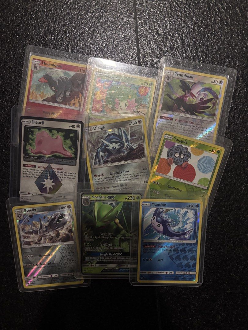 Assorted characters card (Category: Raw Cards) located in Singapore. Submitted by _sodnnzz (Listing ID 1451908706, Image 1). Description: - Assorted Pokemon Card Bundle - Includes English cards: Houndoom, Ditto, Dialga, Sceptile, Mantine - ALL cards are holographic - Perfect for collectors and players •$3.5 shipping • dm for more price info.