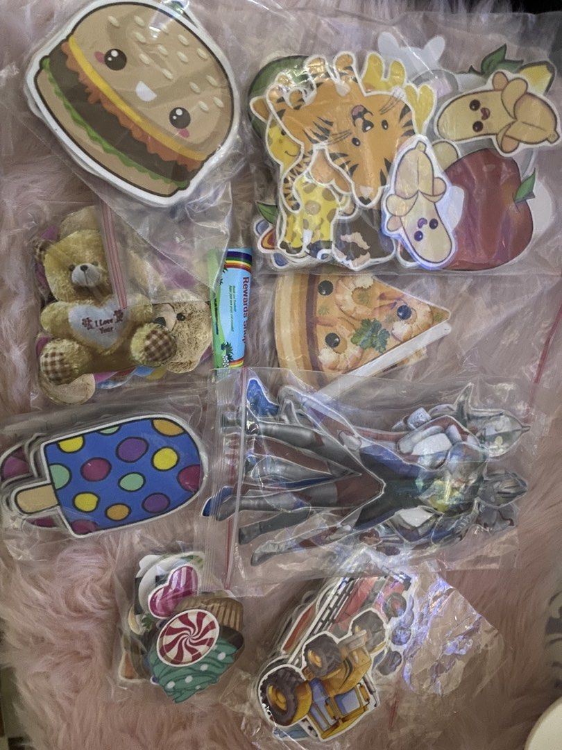 Assorted Cute Stickers - Food, Animals, Characters, and More! (Category: Art & Prints) located in Bauang. Submitted by nrrandomthings (Listing ID 1452074464, Image 2). Description: - Variety sticker pack with lots of fun designs. - Features cute food (burgers, pizza), adorable animals (giraffes), and cool characters. - Also includes ice cream popsicles, teddy bears, and candy designs. - Ideal for decorating notebooks, laptops, water bottles, and 