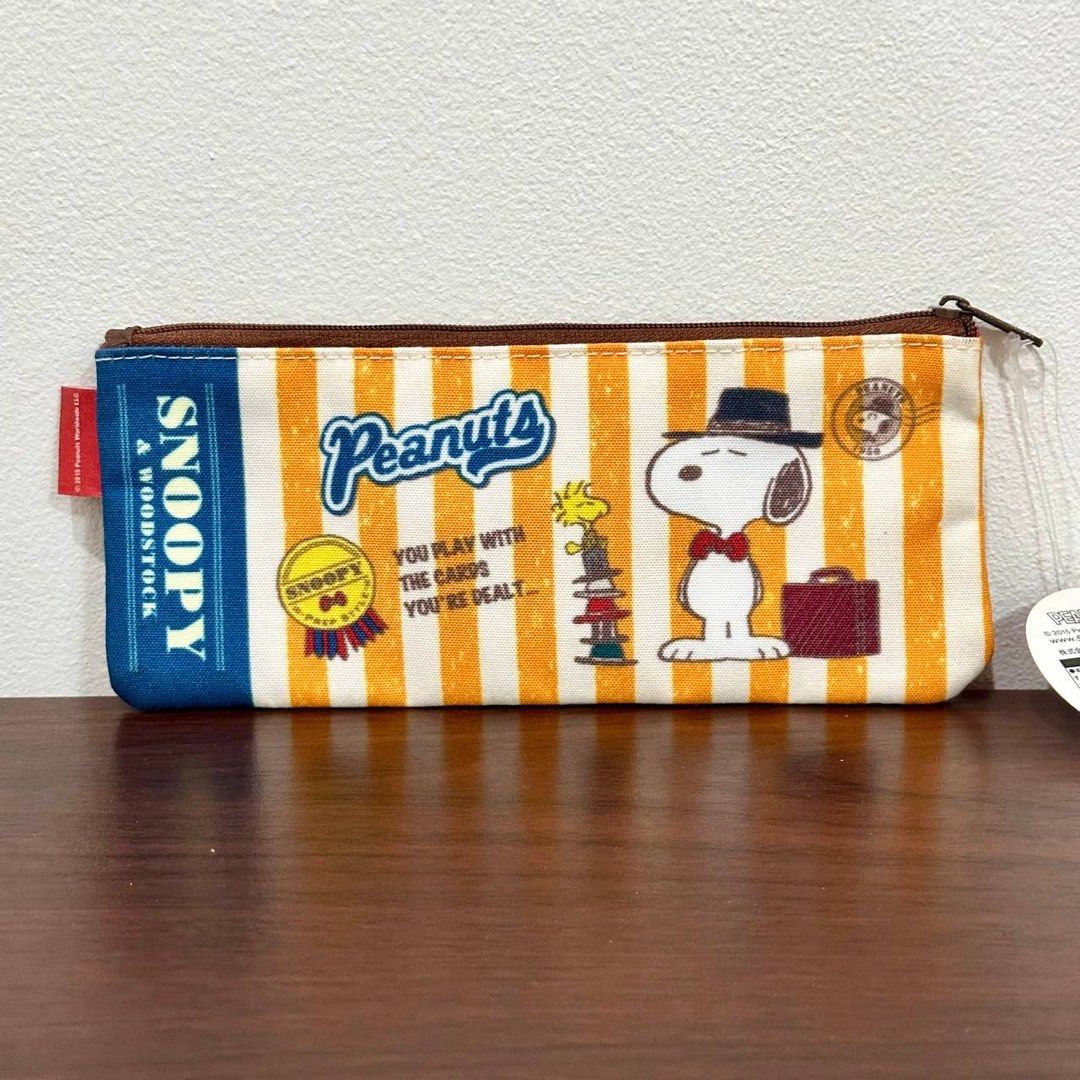 [Authentic] Peanuts Snoopy Slim Pencil Case (Category: Stationery & School Supplies) located in Quezon City. Submitted by brandedusagoodies (Listing ID 1452086135, Image 2). Description: Stay organized with this authentic Peanuts Snoopy Slim Pencil Case featuring an adorable Snoopy design. Its slim profile easily fits inside backpacks, handbags, and laptop bags while providing enough space for pens, pencils, makeup brushes, charging cables, and o
