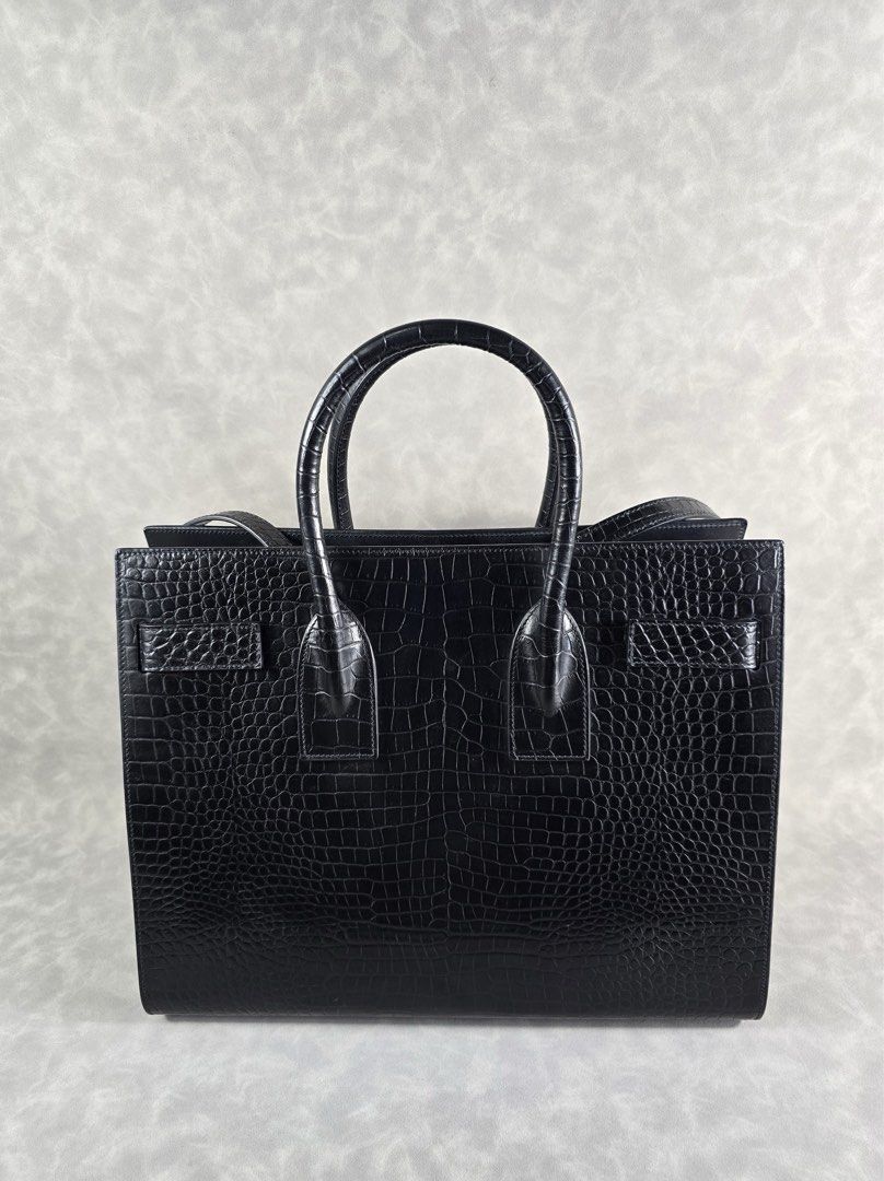 Authentic YSL Sac de Jour Mini Croc (Category: Luxury Bags & Wallets) located in Taguig. Submitted by luxchelry (Listing ID 1452069668, Image 3). Description: Sac de Jour Mini Croc ♦️Comes with dustbag, strap, carecards, lock and keys ♦️9.5/10 ♦️Any discoloration is due to lighting only. ✨️P57000✨️ 📍Taguig All items are 100% authentic. Money back guarantee if the item is proven fake. Disclaimer: All product names, logos, brands and other tradema