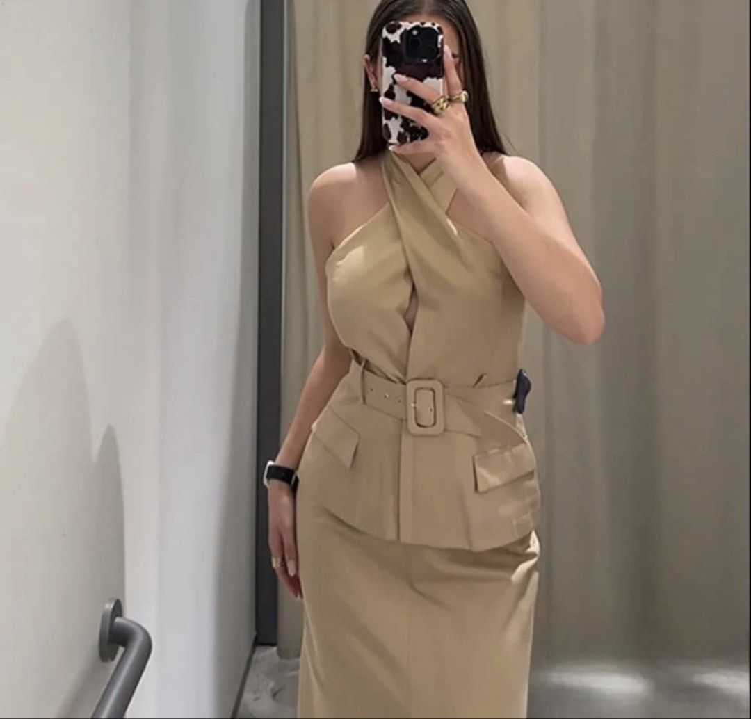 Beige Halter Neck Top and Skirt Set (Category: Sets or Coordinates) located in Cebu City. Submitted by i_van22 (Listing ID 1452070403, Image 3). Description: - Chic beige halter neck top - Unique crossover design with belted waist - Flattering midi skirt silhouette - Comfortable fabric - Ideal for events or a sophisticated look - Looks good on.