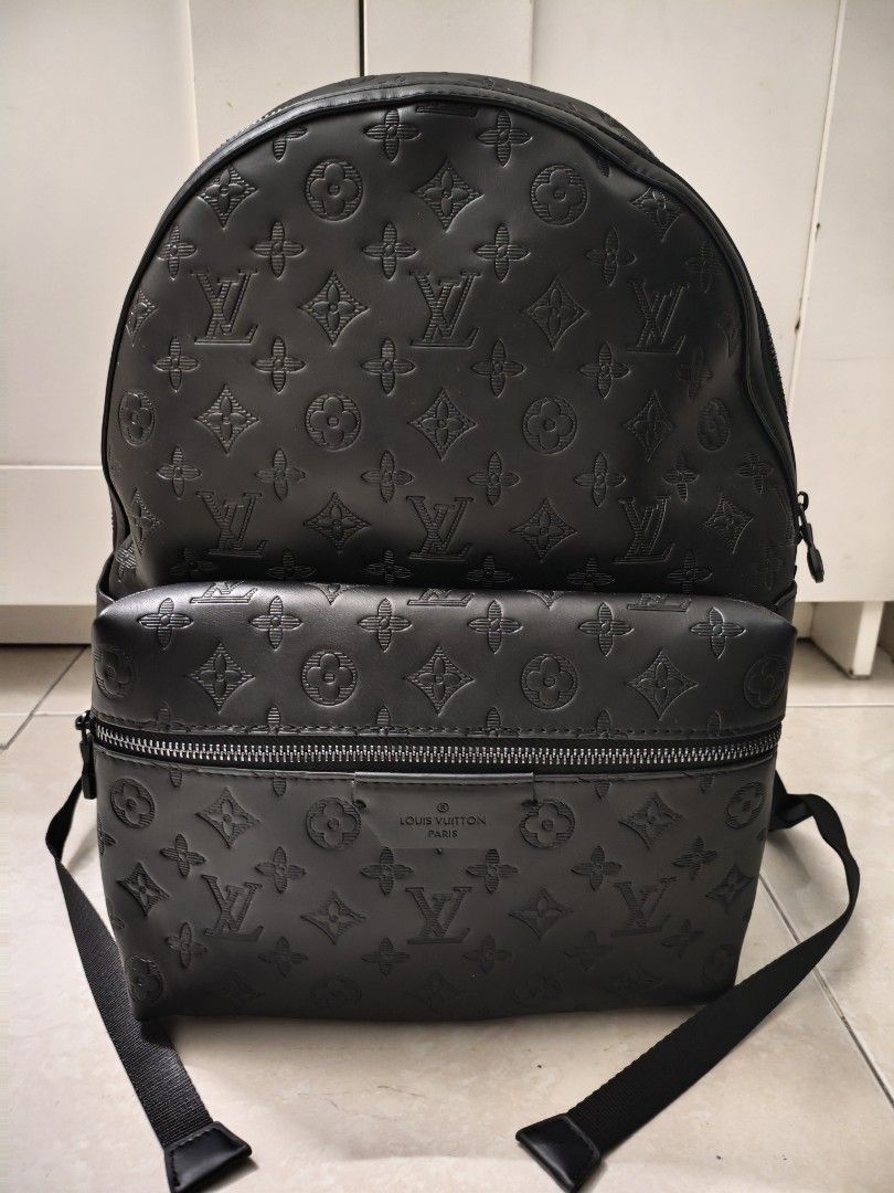 Black Backpack (Category: Bags & Wallets) located in Singapore. Submitted by ammaarriza49229 (Listing ID 1452067992, Image 1). Description: Black leather backpack. Features the iconic monogram pattern embossed all over. Has a front zip pocket and a spacious main compartment with internal pockets. Zippers have logos. Great for everyday use or travel..