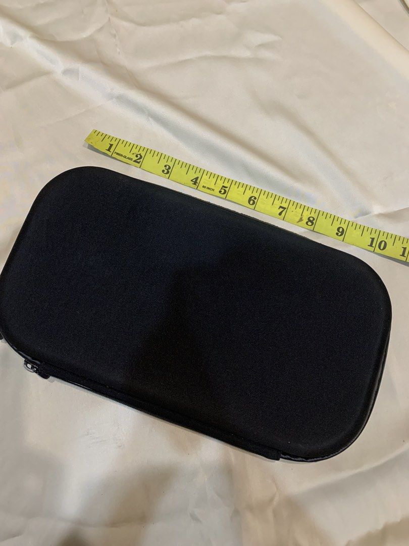 Black Hard Shell Storage Case with Mesh Pocket (Category: Storage Boxes & Baskets) located in Manila. Submitted by gracefilledshop (Listing ID 1452028333, Image 2). Description: - Black storage case with zippered closure. - Interior features a mesh pocket on one side. - Other side has molded compartments for organized storage. - Ideal for travel or keeping items tidy. .