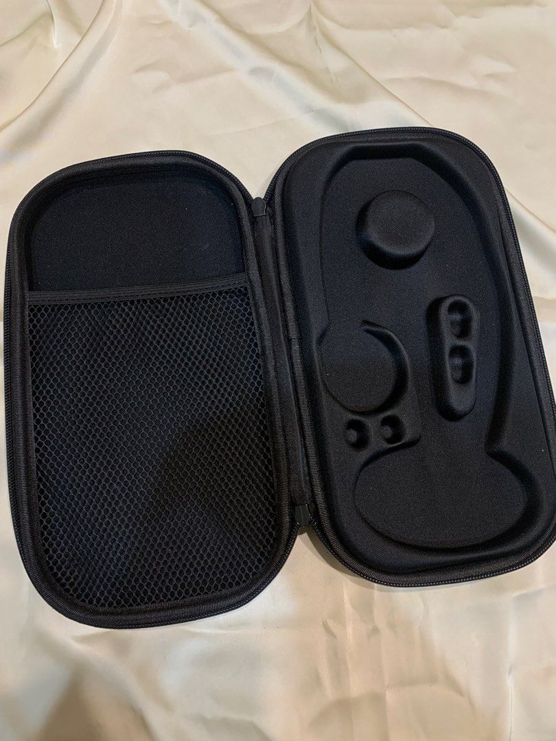 Black Hard Shell Storage Case with Mesh Pocket (Category: Storage Boxes & Baskets) located in Manila. Submitted by gracefilledshop (Listing ID 1452028333, Image 1). Description: - Black storage case with zippered closure. - Interior features a mesh pocket on one side. - Other side has molded compartments for organized storage. - Ideal for travel or keeping items tidy. .