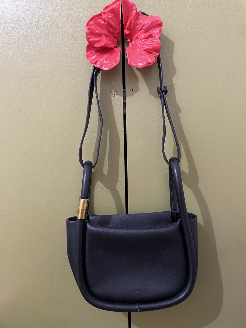 Black Leather Shoulder Bag with Gold Hardware (Category: Luxury Bags & Wallets) located in Nagcarlan. Submitted by joseandjosefinasmom (Listing ID 1452026283, Image 1). Description: Boyy brand bag . You can search it. black leather shoulder bag with a unique curved shape and gold strap accent. Adjustable strap, small embossed logo. Perfect for daily use..
