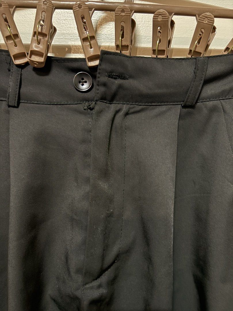 Black Pleated High-Waisted Shorts Size S (Category: Shorts) located in Taguig. Submitted by cftbncs (Listing ID 1452035188, Image 2). Description: - High-waisted black shorts - Front pleats for a stylish detail - Secure button and zip closure - Convenient side pockets - Fabric with a subtle satin - Versatile for casual or dressy looks - Easy to pair with various tops.