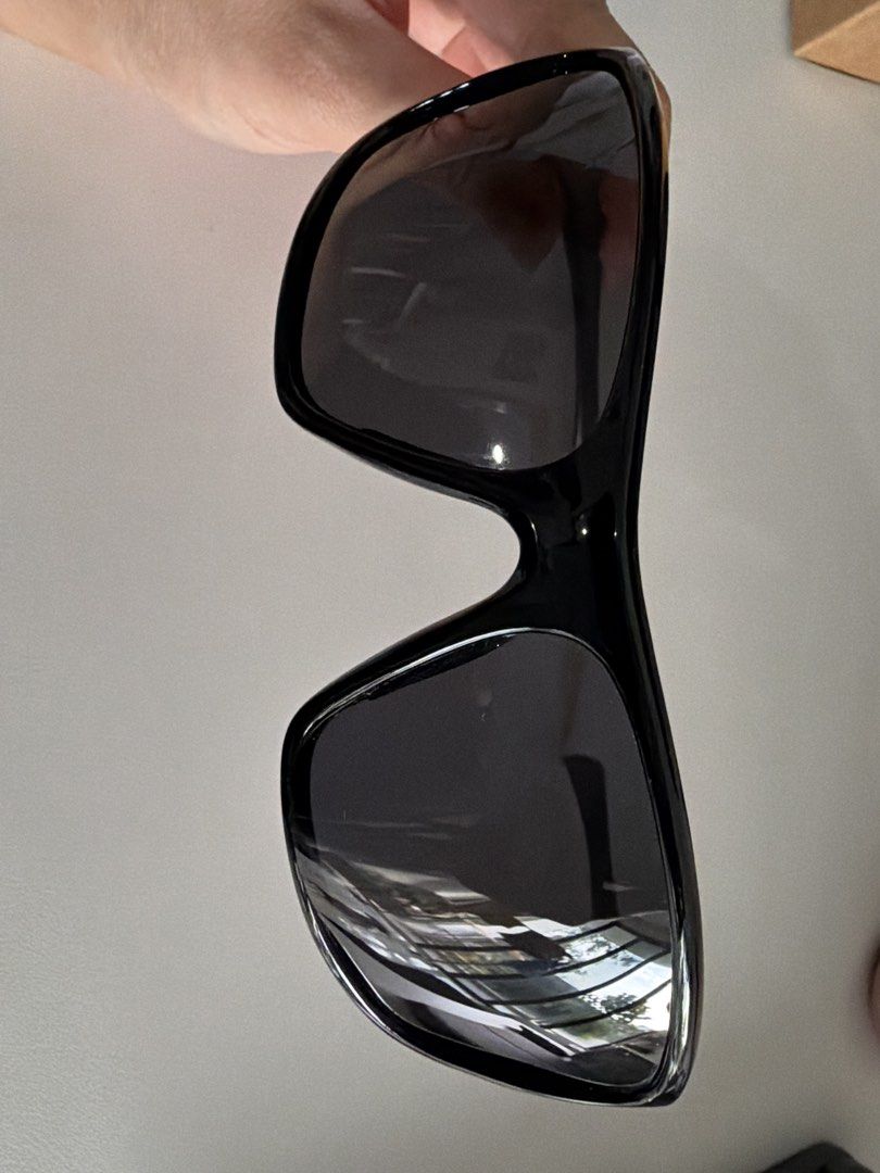 Black Rectangular Sunglasses (Category: Sunglasses & Eyewear) located in Singapore. Submitted by bookwormreally (Listing ID 1452009780, Image 2). Description: - Classic black sunglasses - Dark lenses for sun protection - Rectangular frame shape - Thin arms - Suitable for everyday wear.
