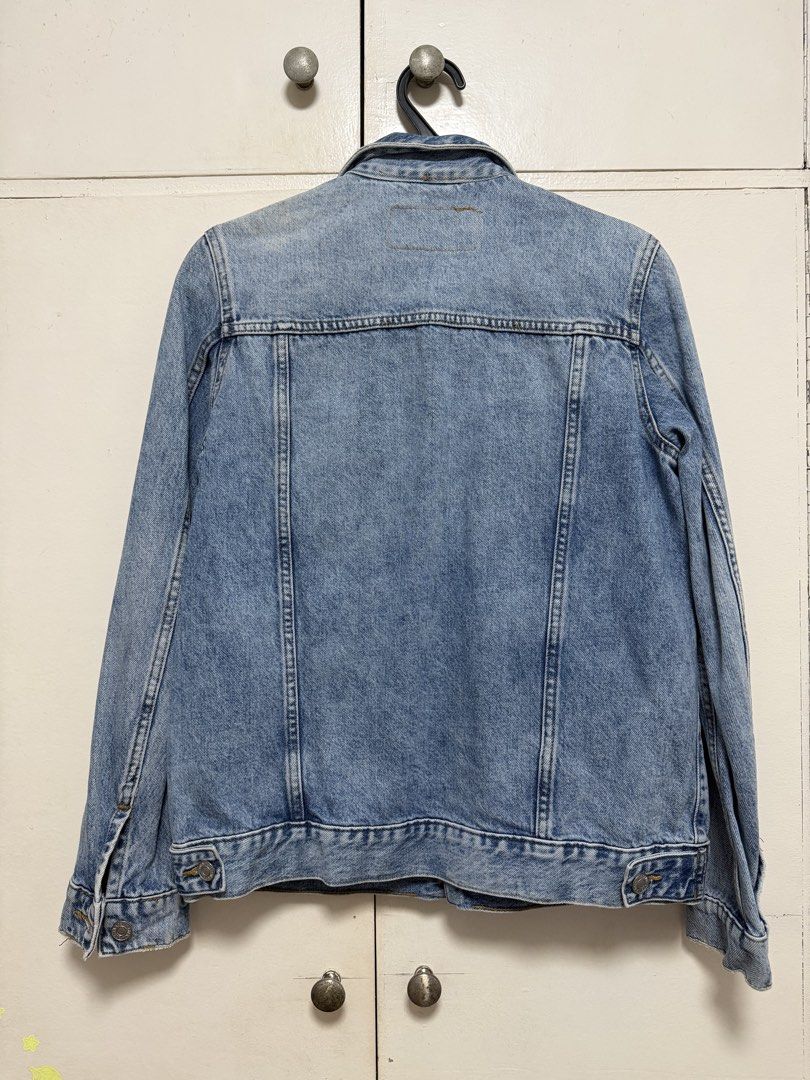 Blue Denim Jacket (Category: Coats, Jackets and Outerwear) located in Bacoor. Submitted by abbybartolome (Listing ID 1452082801, Image 2). Description: - Classic blue denim jacket - Button-up front - Two chest pockets - Standard collar - Regular fit / FITS SMALL TO MEDIUM FRAME - Versatile for layering or standalone wear.