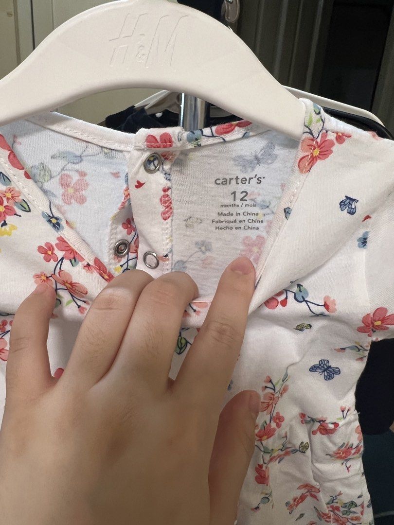 Carter's Baby Dress 12M (Category: Babies & Kids Fashion) located in San Juan City. Submitted by smjose (Listing ID 1451934331, Image 2). Description: - Brand: Carter's - Color: White - Design: Floral print with pink & red flowers, blue butterflies - Sleeves: Short sleeves - Features: Gathered waist, back snaps for easy dressing - Occasion: Perfect for summer wear.