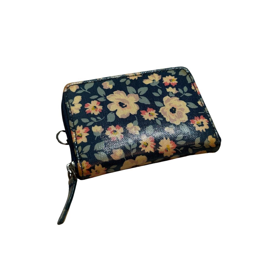 Cath Kidston Floral Zip Around Wallet (Category: Wallets & Card holders) located in Quezon City. Submitted by khsells (Listing ID 1452069304, Image 2). Description: - Adorable Cath Kidston wallet - Charming floral print on navy blue base - Features vibrant yellow and pink flowers - Secure zip closure - Multiple interior compartments for cards and cash - Includes a convenient small wrist strap - Ideal for keeping your essentials neatly organized.