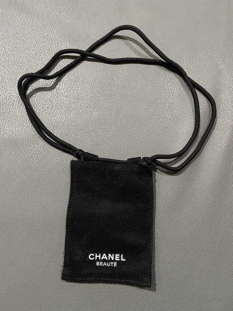 Chanel Beaute Black Pouch with Strap (Category: Luxury Bags & Wallets) located in Pozorrubio. Submitted by izaykite2g (Listing ID 1452063343, Image 1). Description: - Authentic Chanel Beaute pouch - Color: Black - Features a drawstring strap - Includes a zippered compartment - Material: Recycled polyester - Originally a gift with purchase - Ideal for storing small essentials.