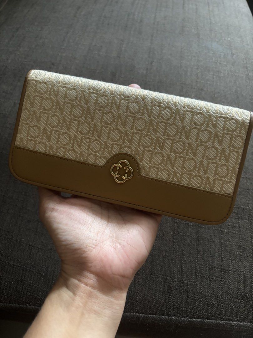 CL by CLN Monogram Wallet (Category: Wallets & Card holders) located in Taguig. Submitted by macxdinglas (Listing ID 1451935694, Image 1). Description: - Brand: CL by CLN - Style: Monogram Wallet - Color: Beige and Tan - Exterior: Zip pocket - Interior: Multiple card slots - Closure: Snap closure - Hardware: Gold details - Condition: Clean inside and out.