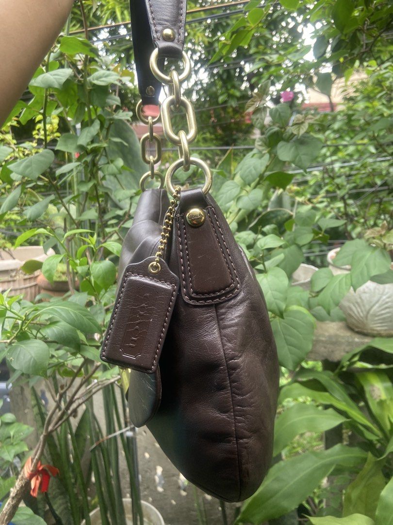 Coach Brown Leather Shoulder Bag with Gold Hardware (Category: Luxury Bags & Wallets) located in Rizal. Submitted by baglovers10 (Listing ID 1446949514, Image 3). Description: - Authentic Coach brown leather shoulder bag - Features a secure turn-lock closure - Stylish gold chain accents on the strap - Unique gathered/pleated leather design on the front - Includes classic Coach hangtag - Ideal for everyday wear.