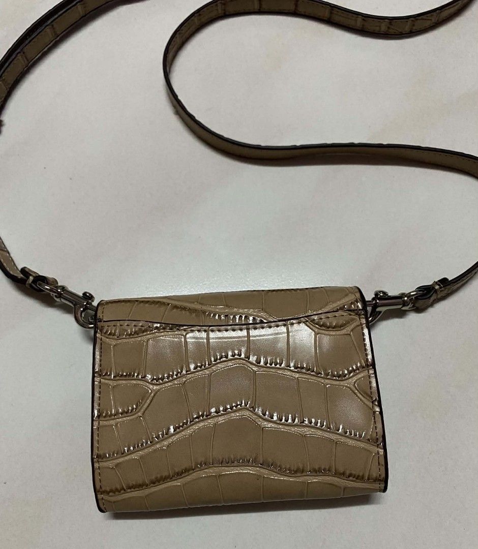 Coach Croc Embossed Wallet with Strap (Category: Luxury Bags & Wallets) located in Manila. Submitted by gutierrez23265 (Listing ID 1451942703, Image 2). Description: - Coach tan croc-embossed wallet - Detachable strap for versatile crossbody or clutch styling - Made in Vietnam - Spacious interior for cards and cash - Ideal for everyday essentials or a stylish night out PLS CHECK ALL PHOTOS DETAILS BEFORE MAGMINE NO RETURN NO EXCHANGE PAYMENT FIRS
