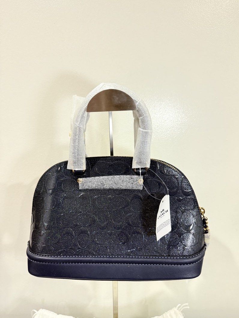 Coach Mini Sierra Satchel - Embossed Grey/Blue (Category: Luxury Bags & Wallets) located in Carmona. Submitted by prelovedbyallia (Listing ID 1452012924, Image 3). Description: Coach Mini Sierra Satchel - Embossed Midnight Grey/Blue • Authentic and bought from the US •Signature debossed patent leather •Inside multifunction pockets •Zip closure, fabric lining •Handles with 3 1/2″ drop •Dual top handles •Structured dome silhouette •Detachable strap