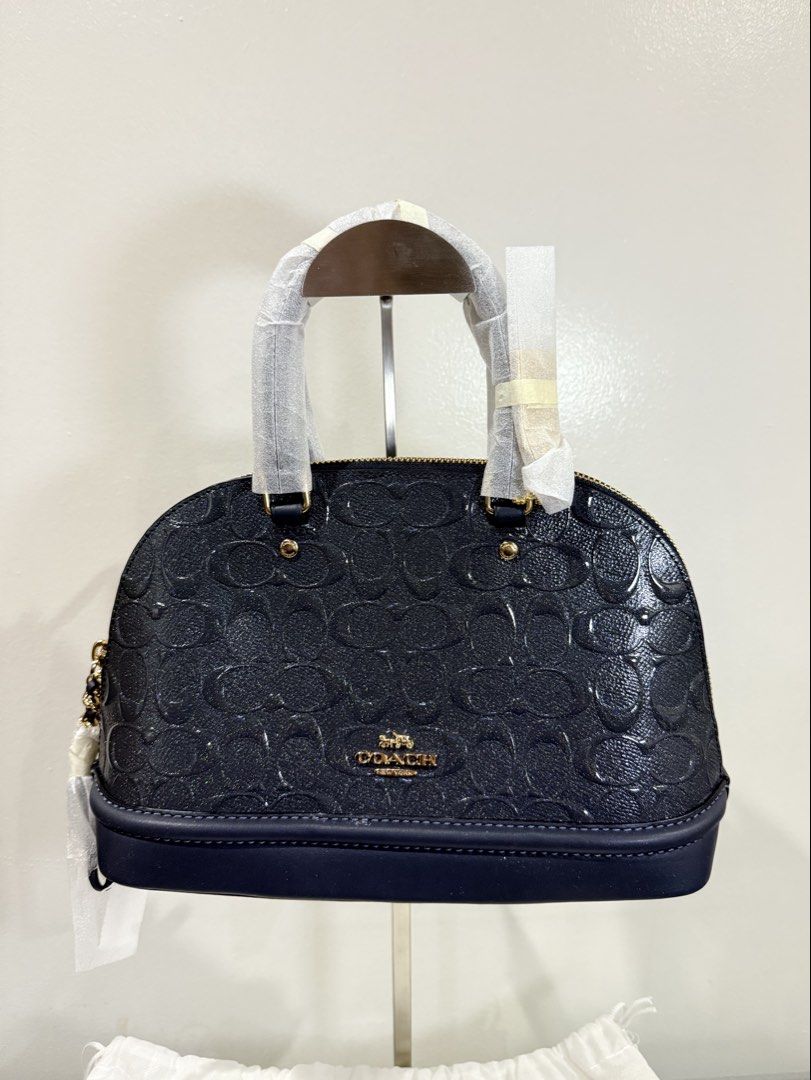 Coach Mini Sierra Satchel - Embossed Grey/Blue (Category: Luxury Bags & Wallets) located in Carmona. Submitted by prelovedbyallia (Listing ID 1452012924, Image 2). Description: Coach Mini Sierra Satchel - Embossed Midnight Grey/Blue • Authentic and bought from the US •Signature debossed patent leather •Inside multifunction pockets •Zip closure, fabric lining •Handles with 3 1/2″ drop •Dual top handles •Structured dome silhouette •Detachable strap
