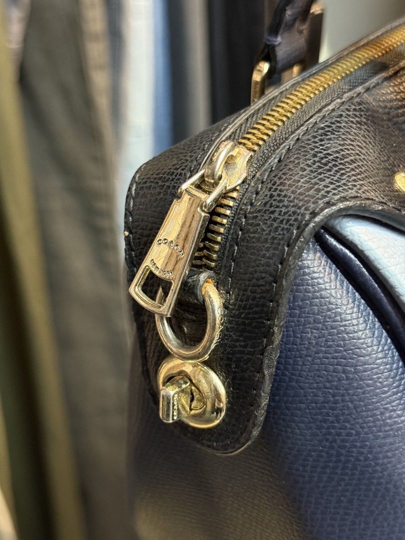 Coach Pebbled Leather Satchel Bag Navy Blue Grey (Category: Luxury Bags & Wallets) located in Legazpi City. Submitted by deadthrift (Listing ID 1452096150, Image 3). Description: - Coach satchel bag - Mix of grey and navy blue pebbled leather - Gold hardware details - Zipper closure - Top handles - Interior Coach creed patch - Great everyday bag.