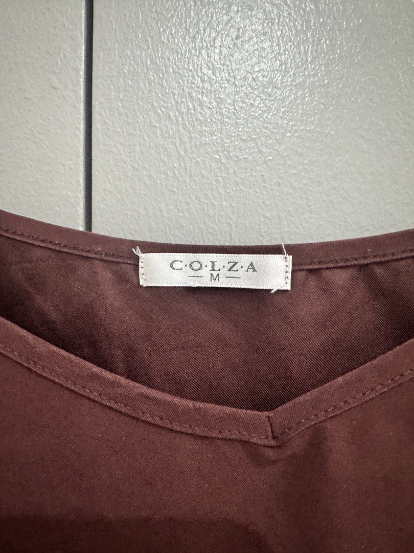 COLZA Brown V-Neck Spaghetti Strap Top Size M (Category: Sleeveless) located in Quezon City. Submitted by jaebaeee (Listing ID 1452094543, Image 2). Description: - COLZA brown spaghetti strap top - V-neckline - Size: Medium (M) - Suede fabric feel - Versatile: great for layering or wearing alone - Easy to style with various bottoms.
