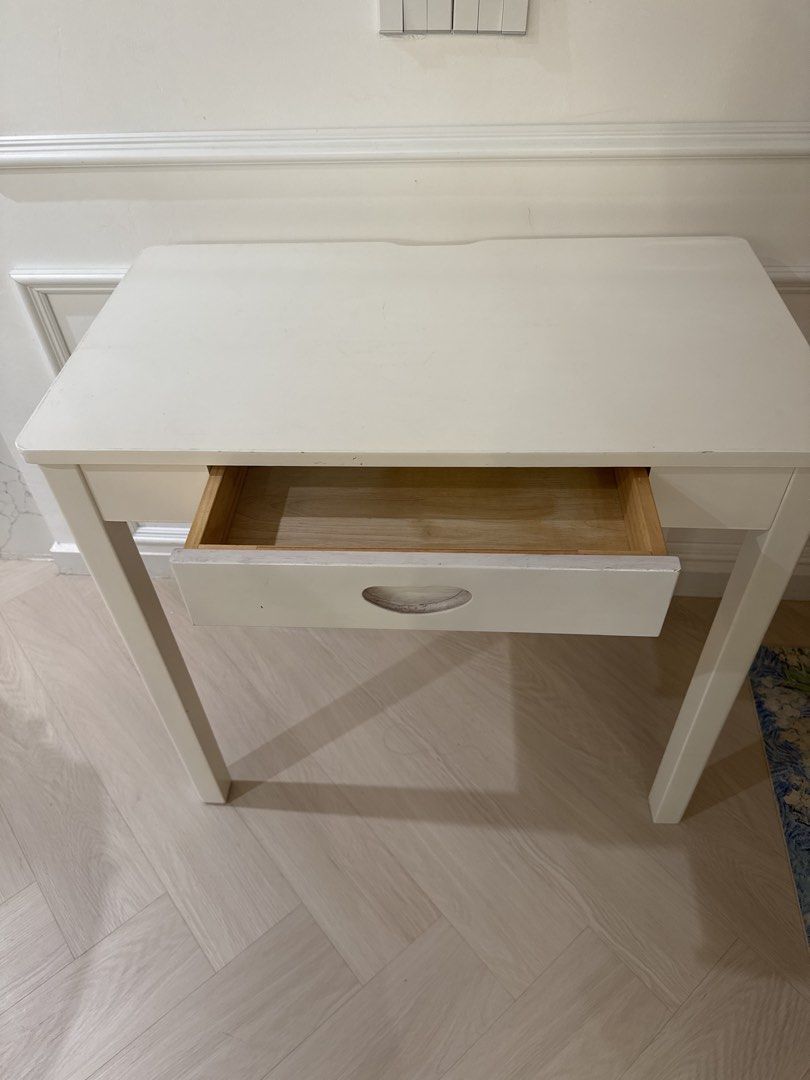 Computer table/Study table/White Table with Drawer (Category: Tables & Sets) located in Singapore. Submitted by szhou17 (Listing ID 1452075743, Image 1). Description: 80cm *45cm*75cm - Simple white console table - Features one drawer with cutout handlen - Sturdy, straight legs - Flat, clean top surface - Ideal for use as a side table or small desk - Versatile for any room.