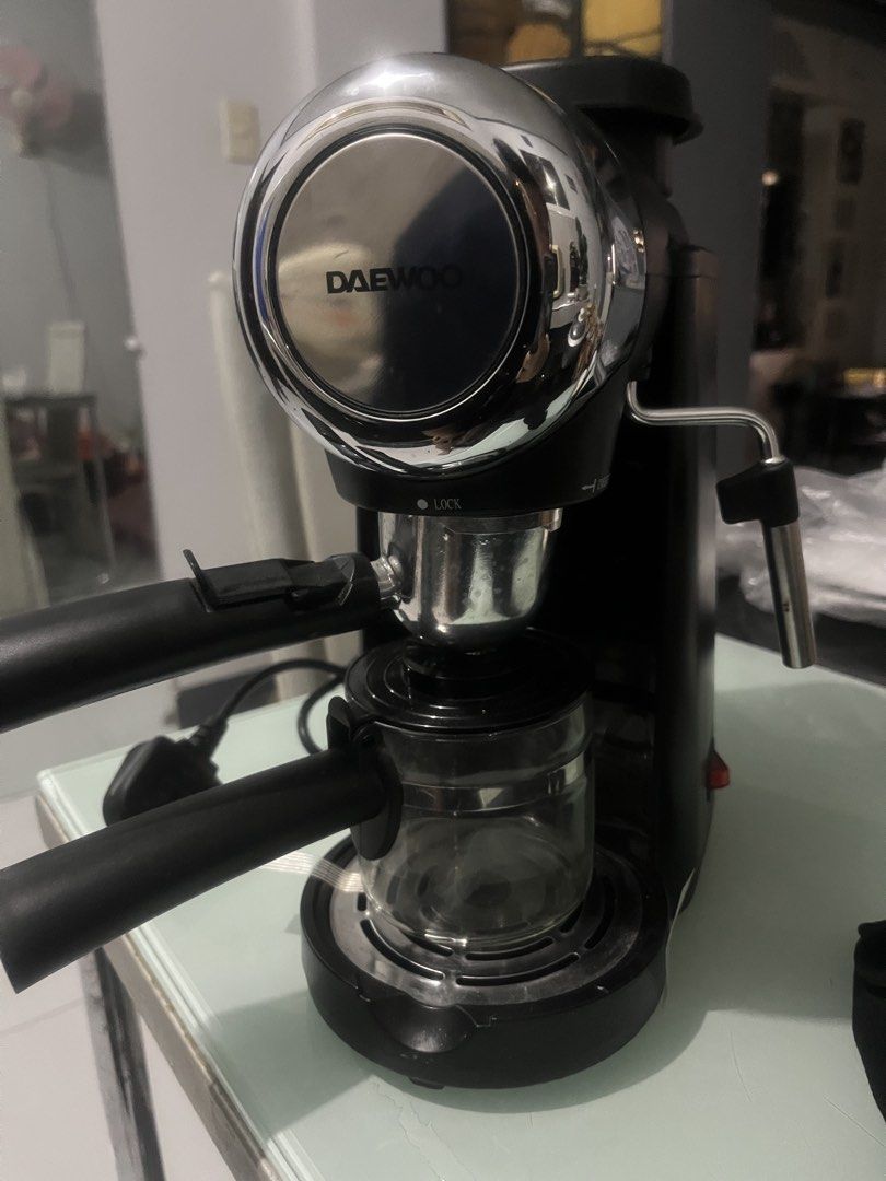 DAEWOO Espresso Machine Coffee Maker (Category: Coffee Machines & Makers) located in Gapan. Submitted by yoongi_one (Listing ID 1452008121, Image 2). Description: Black DAEWOO espresso machine with chrome accent. Includes portafilter and steam wand. Simple on/off operation. Compact and perfect for home use..