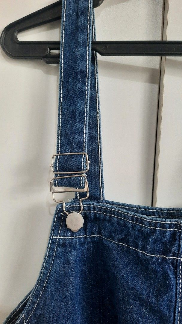 Denim Overalls Jumpsuit Wide Leg (Category: Sets & Coordinates) located in Cainta. Submitted by tinsbottomdrawer (Listing ID 1451941943, Image 3). Description: - Classic blue denim overalls - Relaxed wide leg cut - Adjustable straps with buckle closure - Button details on the sides - Two back pockets - Ideal for casual wear - Easy to style with t-shirts or crop tops Measurement: Waist Width: 51cm Length from shoulder / strap: 138cm.