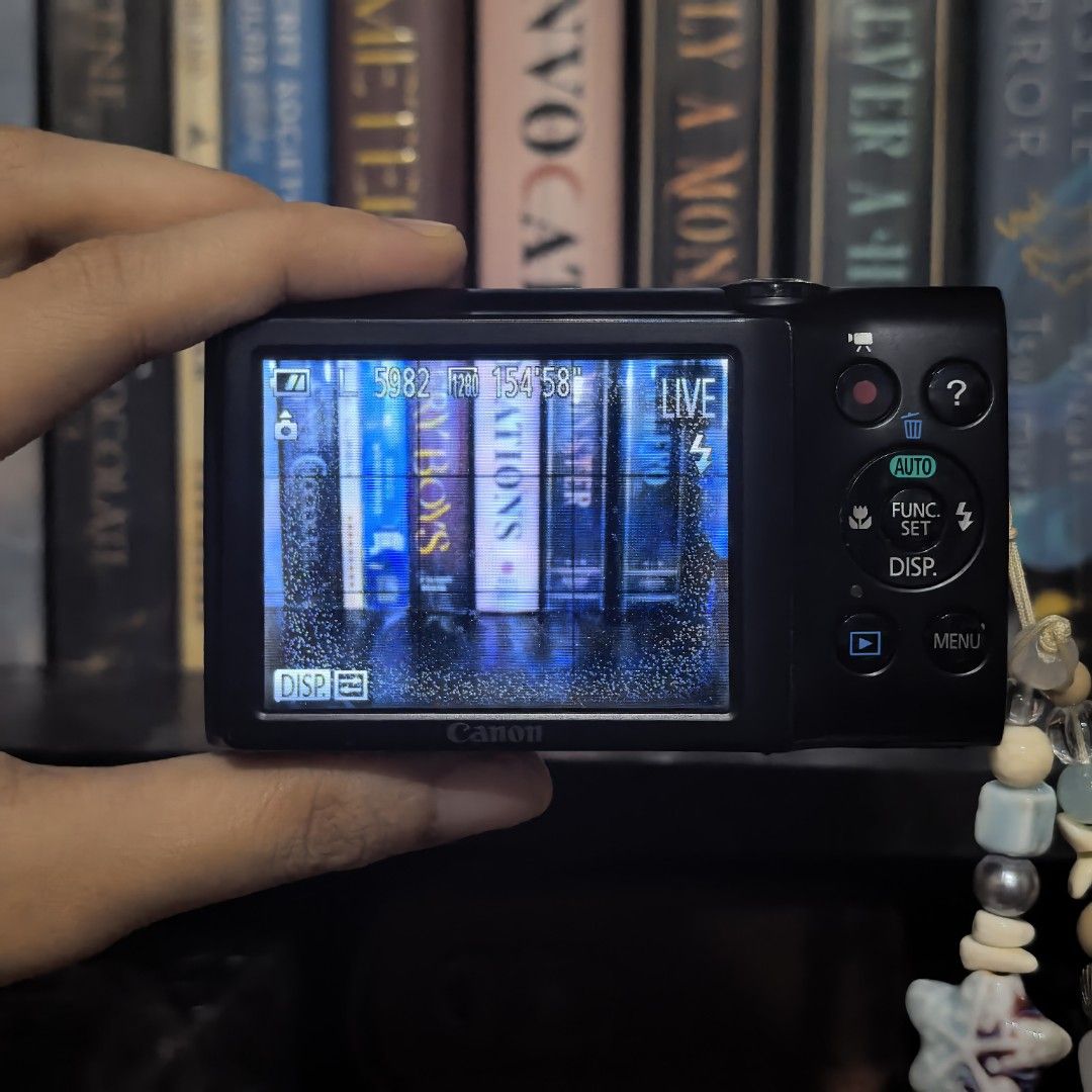 [DIGICAM/DIGITAL CAMERA WITH BOX] Canon A2300 HD (Category: Cameras) located in Las Pinas. Submitted by nicsknacksandbooks (Listing ID 1452062682, Image 3). Description: Issue: LCD burn (as seen sa pic) ---- Working flash, zoom, and all buttons Mop: Gcash (NO COD) Mod: Direct J&T, Lalamove.