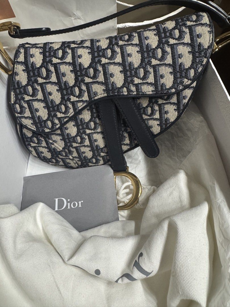 Mini Dior Saddle Bag Oblique Canvas (Category: Luxury Bags & Wallets) located in San Fernando. Submitted by ThrifinityandBeyond (Listing ID 1452032664, Image 2). Description: - ORIGINAL Dior Saddle Bag - Iconic Dior Oblique canvas - Genuine leather trim - Elegant gold hardware - Includes original dust bag - Comes with authenticity card (from dior vancouver) - A must-have classic for your collection - complete inclusion (box, card, pouch) .
