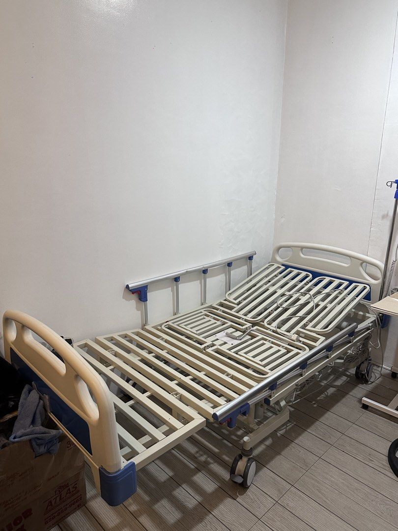Electric Hospital Bed with Remote Control (Category: Bed Frames & Mattresses) located in Quezon City. Submitted by royallion.66575c (Listing ID 1452015034, Image 3). Description: - Adjustable electric hospital bed - Remote control for bed positions - Safety side rails included - Wheels for easy mobility - Perfect for home care needs - Selling as is.