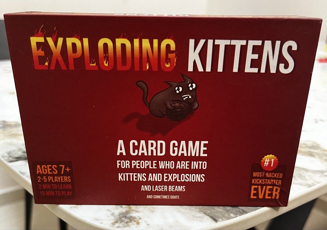 Exploding Kittens card game (Category: Card Boxes & Cases) located in Singapore. Submitted by stellalee2015 (Listing ID 1452047380, Image 1). Description: Exploding kittens card game played 1-2 times.