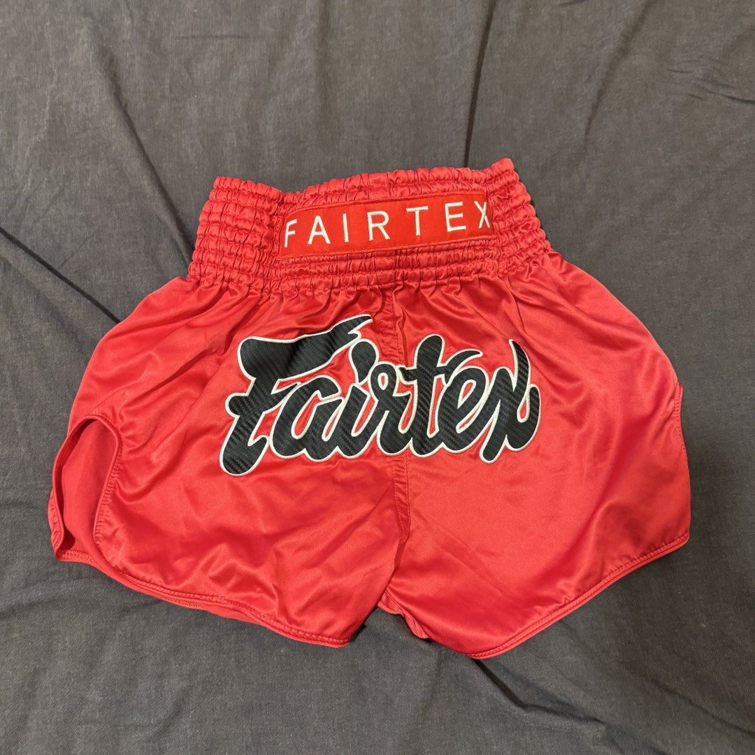 Fairtex Red Muay Thai Shorts (Category: Shorts) located in Manila. Submitted by jpumpa (Listing ID 1452049382, Image 1). Description: - Authentic Red Fairtex Muay Thai shorts - Features iconic Fairtex logo on front and waistband - Ideal for Muay Thai training, sparring, and workouts - Designed for a comfortable fit with a wide elastic waistband - Made with durable material to withstand intense sessions.