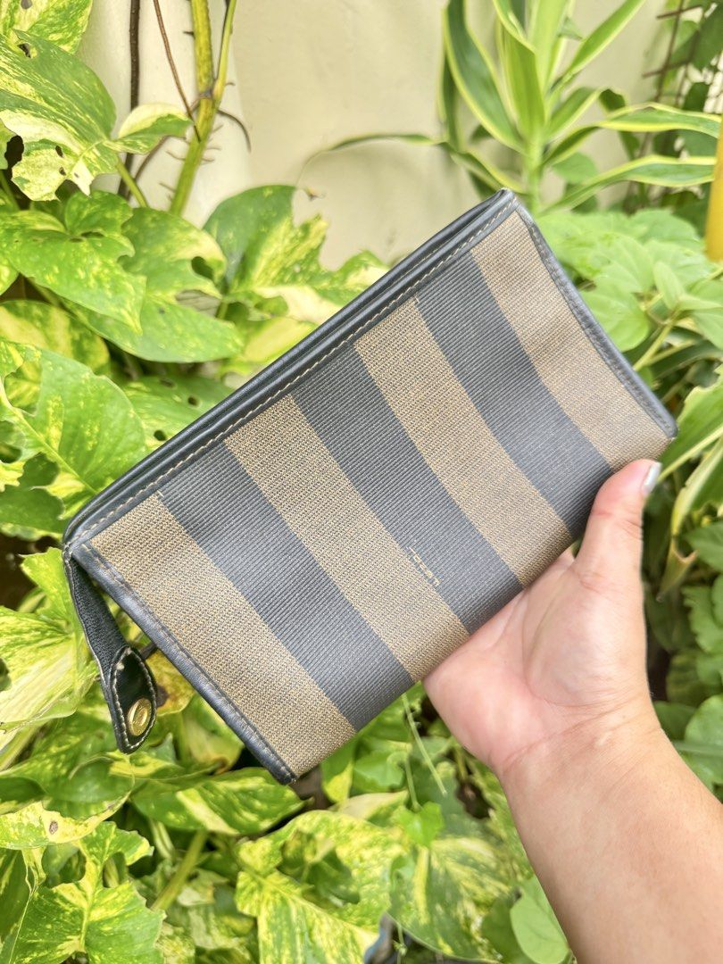 Fendi Zucca Striped Canvas Leather Wallet (Category: Luxury Bags & Wallets) located in Cainta. Submitted by danica010314 (Listing ID 1452038403, Image 2). Description: - Classic Fendi wallet with iconic Zucca pattern - Durable canvas and leather construction - Interior zippered compartment for secure storage - Elegant gold-tone hardware with Fendi logo - Ideal for carrying your daily essentials.