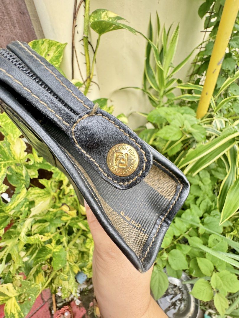 Fendi Zucca Striped Canvas Leather Wallet (Category: Luxury Bags & Wallets) located in Cainta. Submitted by danica010314 (Listing ID 1452038403, Image 3). Description: - Classic Fendi wallet with iconic Zucca pattern - Durable canvas and leather construction - Interior zippered compartment for secure storage - Elegant gold-tone hardware with Fendi logo - Ideal for carrying your daily essentials.