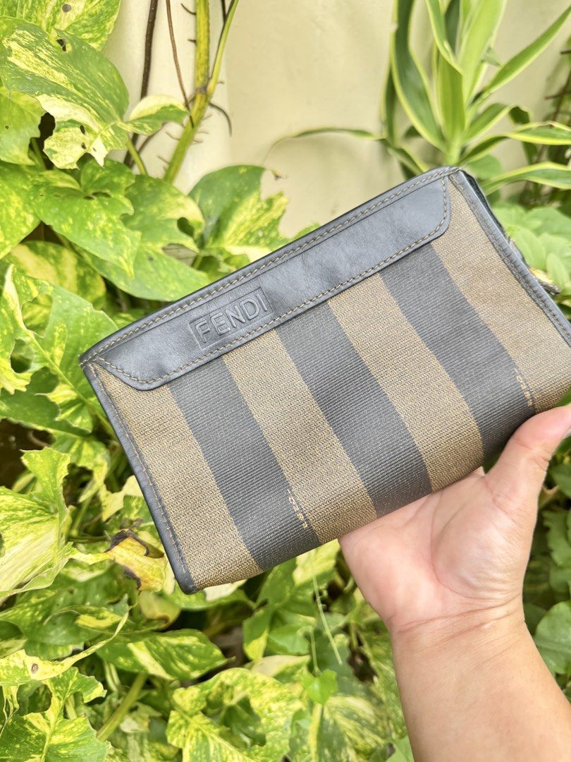 Fendi Zucca Striped Canvas Leather Wallet (Category: Luxury Bags & Wallets) located in Cainta. Submitted by danica010314 (Listing ID 1452038403, Image 1). Description: - Classic Fendi wallet with iconic Zucca pattern - Durable canvas and leather construction - Interior zippered compartment for secure storage - Elegant gold-tone hardware with Fendi logo - Ideal for carrying your daily essentials.