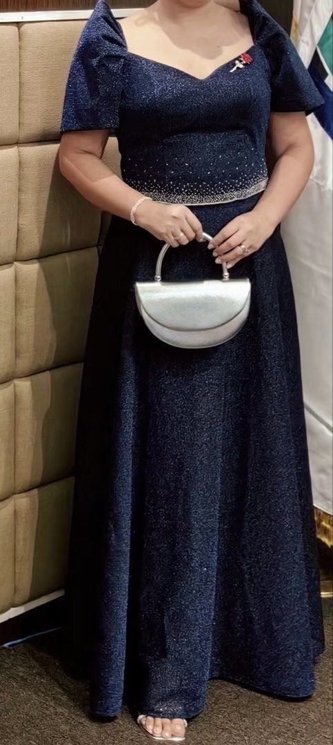 Filipinian Gown (Category: Evening dresses & gowns) located in Bulacan. Submitted by mreyes21 (Listing ID 1452030884, Image 2). Description: - Elegant navy blue formal gown - All-over sparkly fabric for a dazzling look - Flattering puff sleeves and sweetheart neckline - Beautiful beaded detail at the waist - Floor-length design, perfect for formal events - Ideal for parties and special occasions.