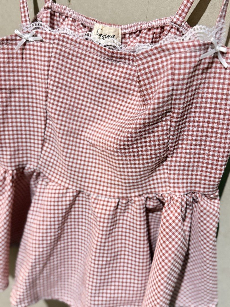 Gingham Peplum Camisole Top with Lace Trim (Category: Sleeveless) located in Manila. Submitted by kimchimie (Listing ID 1452028142, Image 2). Description: - Adorable red and white gingham camisole top. - Flattering peplum hem for a nice shape. - Thin, adjustable straps with cute white bows. - Delicate lace trim along the neckline. - xs to s.