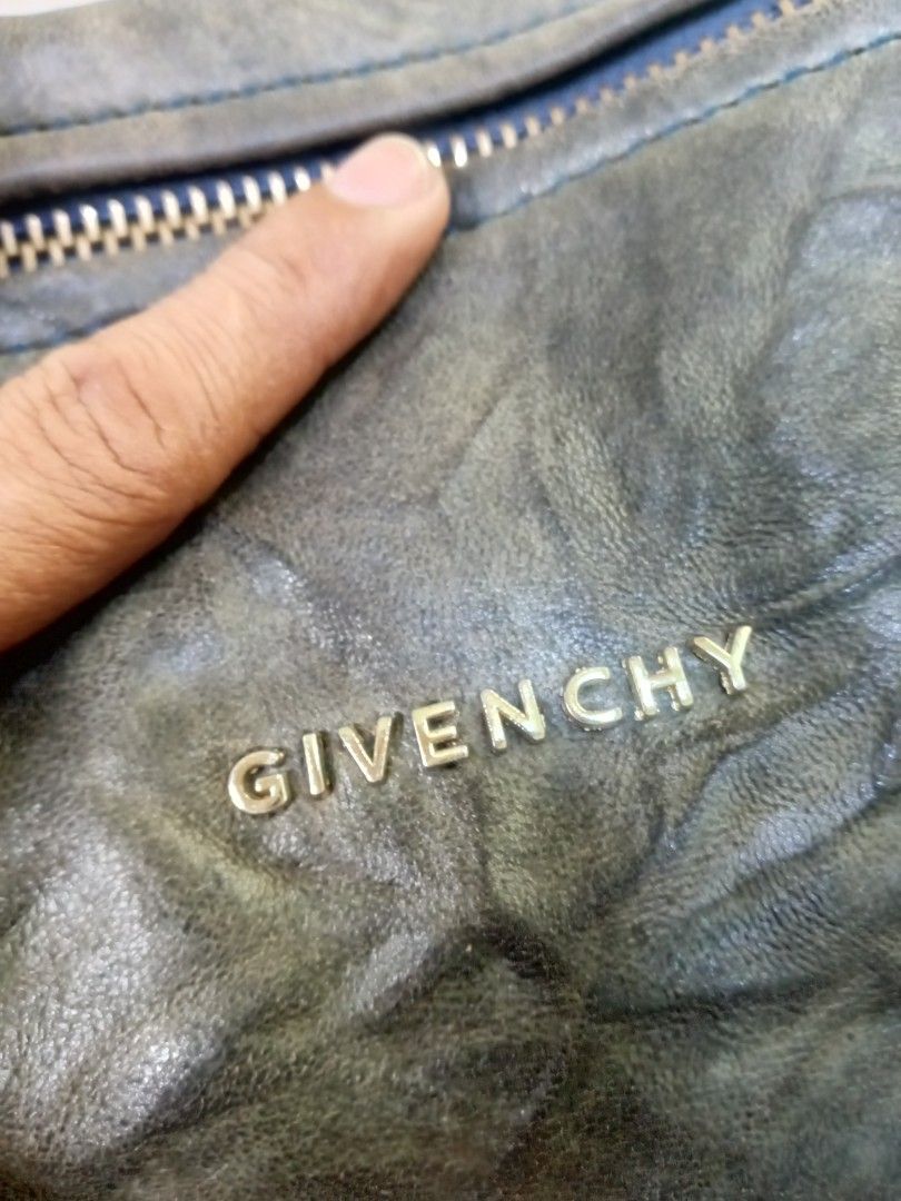 Givenchy Leather Shoulder Bag (Category: Luxury Bags & Wallets) located in Manila. Submitted by onewikstraight (Listing ID 1451910412, Image 2). Description: - Authentic Givenchy leather shoulder bag Vintage - Made in Italy - Unique distressed leather finish - Multiple zippered compartments - Features YKK zippers - Ideal for everyday use pm 📨 📥 cavite location 4000+sf.