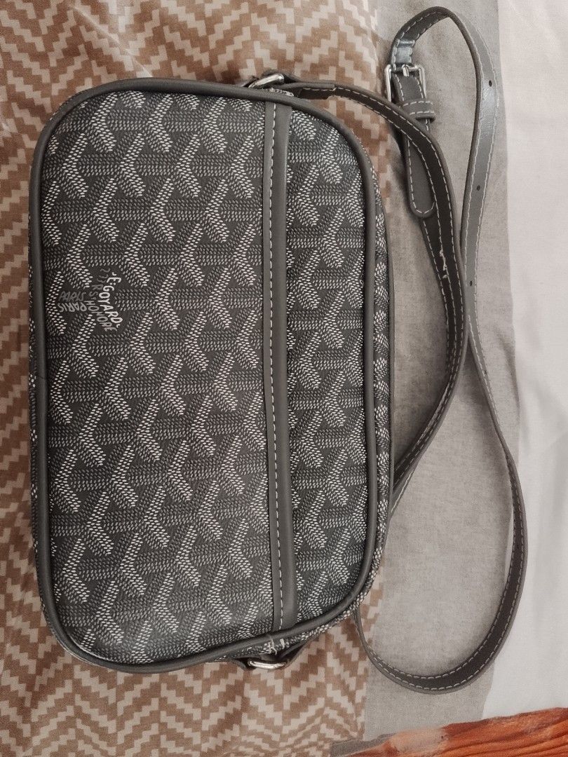 Goyard Grey Monogram Crossbody Bag (Category: Luxury Bags & Wallets) located in Manila. Submitted by jheorula (Listing ID 1451924407, Image 1). Description: - Authentic Grey Goyard crossbody bag - Iconic classic monogram pattern - Genuine leather trim and strap - Adjustable strap for personalized comfort - Compact and practical for carrying essentials - Ideal for everyday use and travel.