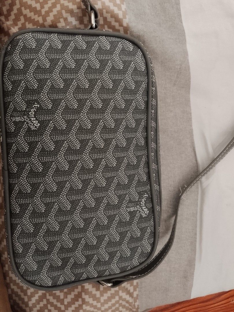 Goyard Grey Monogram Crossbody Bag (Category: Luxury Bags & Wallets) located in Manila. Submitted by jheorula (Listing ID 1451924407, Image 2). Description: - Authentic Grey Goyard crossbody bag - Iconic classic monogram pattern - Genuine leather trim and strap - Adjustable strap for personalized comfort - Compact and practical for carrying essentials - Ideal for everyday use and travel.