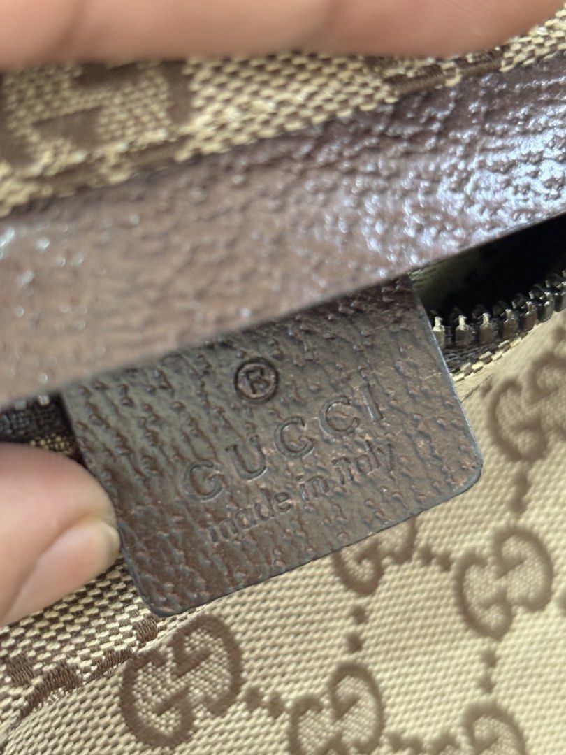 Gucci GG Monogram Canvas Belt Bag (Category: Luxury Bags & Wallets) located in Tarlac. Submitted by yourewelcome.1 (Listing ID 1452074746, Image 3). Description: - Authentic Gucci Belt Bag - Classic GG Monogram Canvas - Brown Leather Trim - Adjustable Strap with Green & Red Stripe Detail - Main Compartment - Front Zip Pocket - Made in Italy - Serial Number: 28566 002058.