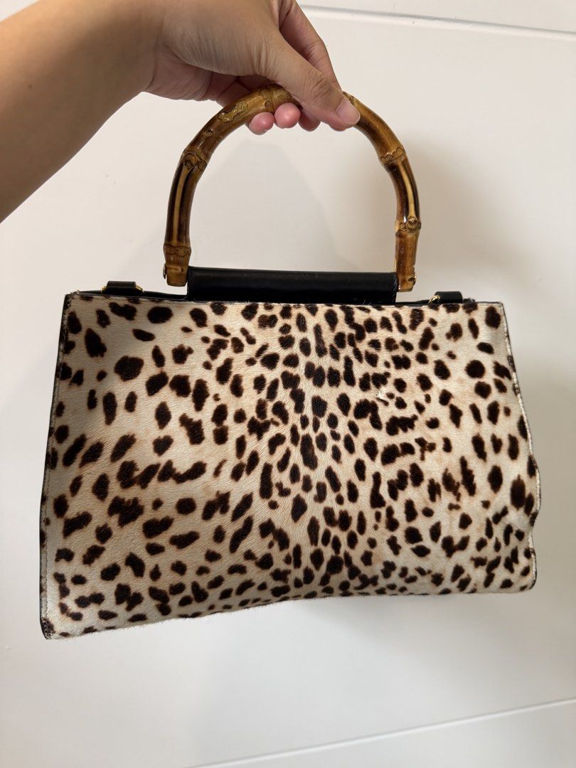 Gucci Leopard Print Top Handle Bag (Category: Luxury Bags & Wallets) located in San Jose del Monte. Submitted by shoprheag (Listing ID 1452038996, Image 1). Description: *REPRICED* FROM ₱ 17,500 TO ₱15,000 YOU MAY ALSO SHOOT YOUR OFFER AS LONG AS IT IS REASONABLE (NOT HALF THE POSTED PRICE, OK?) THIS BAG IS ALSO NOT FOR PICKY BUYERS! SELLING LOW ALREADY FOR A GUCCI BAG. -Orig w/ care tag and B101 authentication cert Leopard print handbag (made of