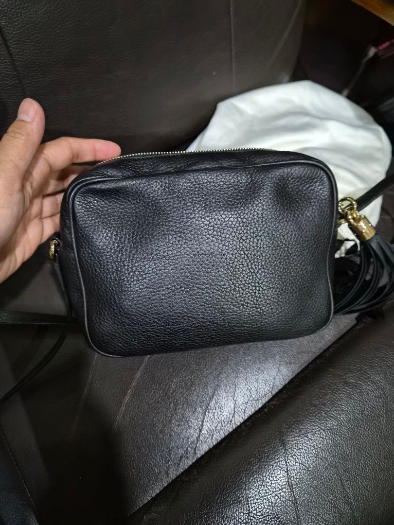 Gucci Soho Disco Bag Black Leather (Category: Luxury Bags & Wallets) located in Caloocan City. Submitted by ara_finds (Listing ID 1452102871, Image 2). Description: - Authentic Gucci Soho Disco Bag - Color: Black - Material: Pebbled Leather - Iconic interlocking G logo on front - Tassel zipper pull - Gold hardware - Interior zip pocket - Includes dust bag - Includes authenticity card - Ideal for everyday use.