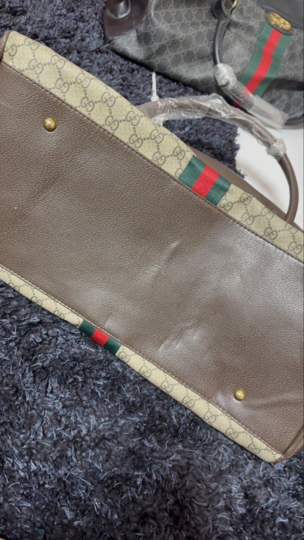 Gucci Travel Bag (Category: Luxury Bags & Wallets) located in Pasay City. Submitted by cml_things (Listing ID 1452100218, Image 2). Description: Two way Gucci Travel Bag - Have sling Color Brown and Black.