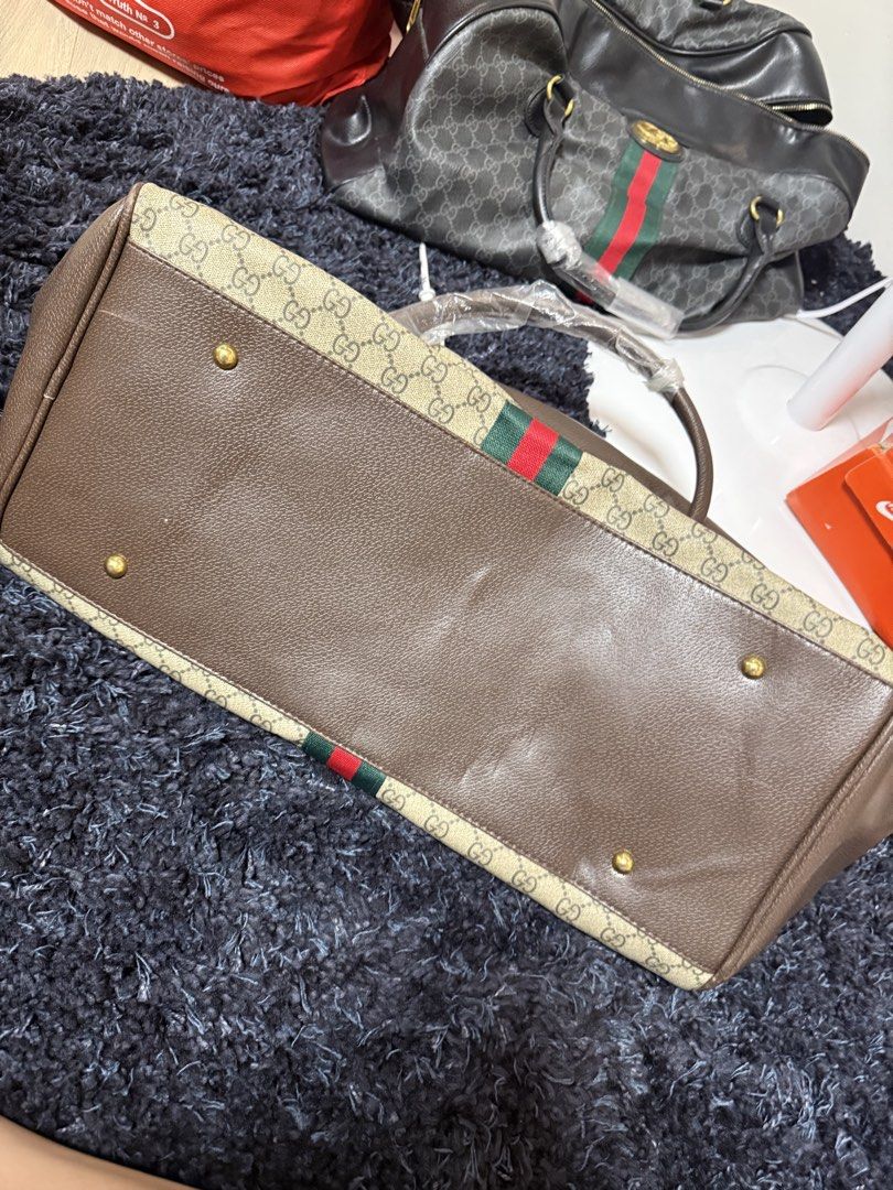 Gucci Travel Bag (Category: Luxury Bags & Wallets) located in Pasay City. Submitted by cml_things (Listing ID 1452100218, Image 3). Description: Two way Gucci Travel Bag - Have sling Color Brown and Black.