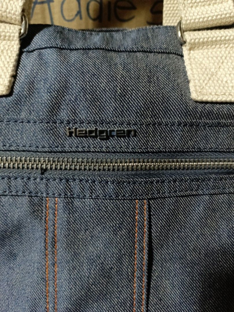 Hedgren Denim Backpack Hand Bag (Category: Tote Bags) located in Subic. Submitted by addiestrend (Listing ID 1452088589, Image 2). Description: - Versatile Hedgren denim bag - Can be used as a tote or a backpack - Adjustable straps - Main compartment with zip closure - Front zip pocket - Interior zip pocket RFID - Dimensions: Approx. 13 x 13 x 4 inches - Ideal for everyday use, school or work -missing the hangtag / keychain (ninakaw sa baggage) P