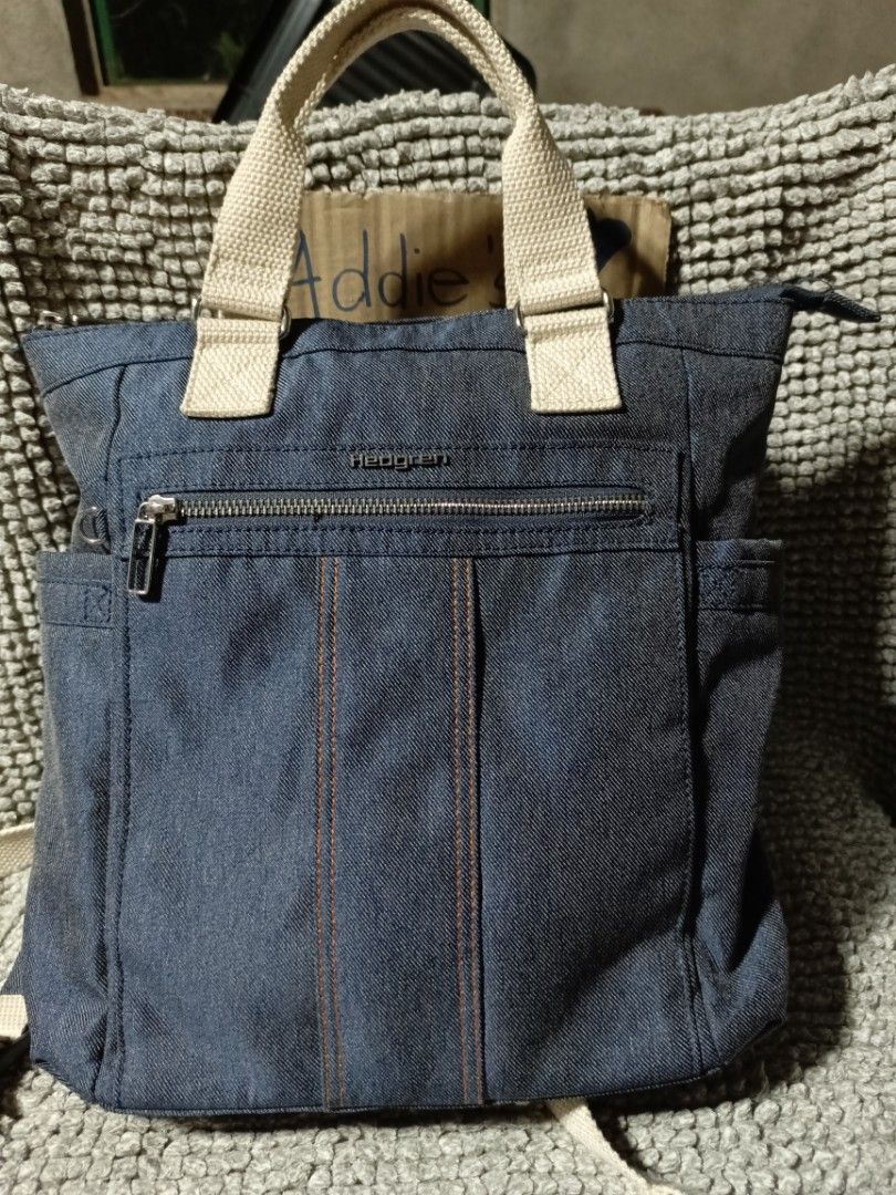 Hedgren Denim Backpack Hand Bag (Category: Tote Bags) located in Subic. Submitted by addiestrend (Listing ID 1452088589, Image 1). Description: - Versatile Hedgren denim bag - Can be used as a tote or a backpack - Adjustable straps - Main compartment with zip closure - Front zip pocket - Interior zip pocket RFID - Dimensions: Approx. 13 x 13 x 4 inches - Ideal for everyday use, school or work -missing the hangtag / keychain (ninakaw sa baggage) P